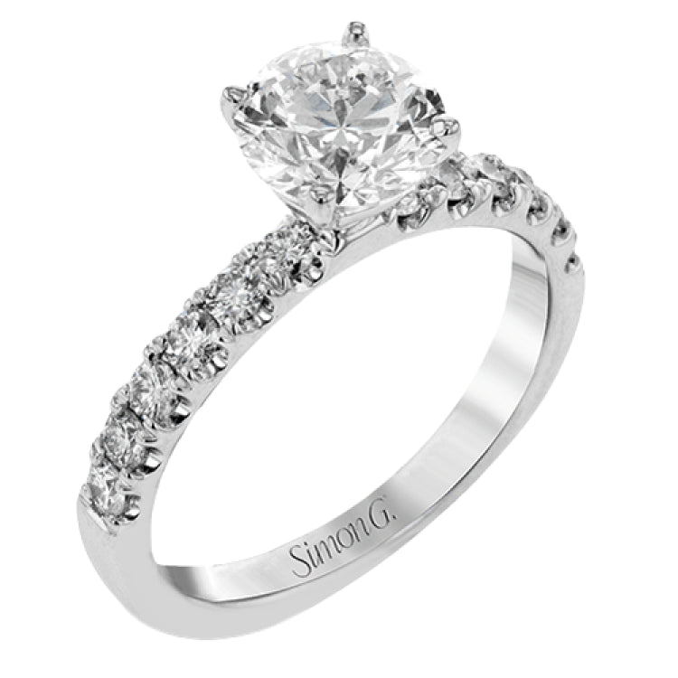This distinctive bridal set design features a double-layer wedding band that fits around the engagement ring. The set contains .77 ctw of white diamonds.