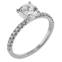 This distinctive bridal set design features a double-layer wedding band that fits around the engagement ring. The set contains .77 ctw of white diamonds.