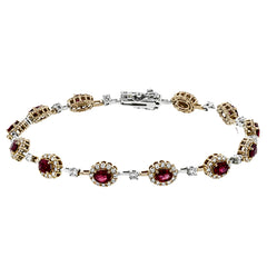 This 18K rose gold bracelet features 2.0 ctw of oval Rubies each surrounded by white diamonds 1.44 ctw., 7