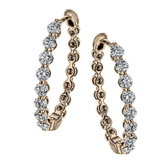 Dazzling yet refined, these rose gold hoops showcase an impressive 1.51 ctw of white diamonds