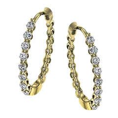 This pair of 18k yellow gold hoop earrings are the perfect size for everyday wear, and shine with .33 ctw of yellow diamonds.