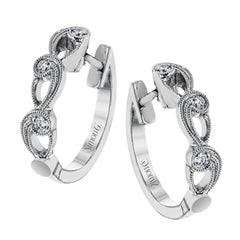 These beautiful white gold earrings feature an intricate scrolling design with .11 ctw of round white diamonds for just a hint of sparkle.