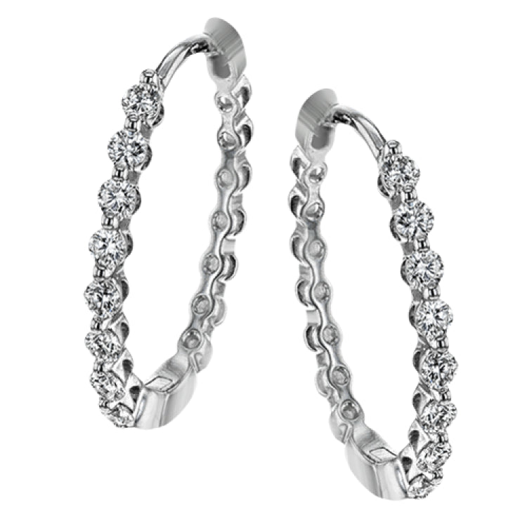 These classic white gold hoops glimmer with .33 ctw of white diamonds