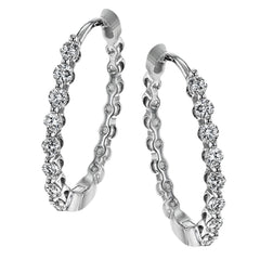 These classic white gold hoops glimmer with .33 ctw of white diamonds