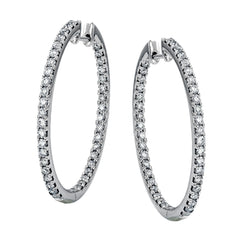 Dramatic yet refined, these white gold earrings contain 1.52 ctw of white diamonds
