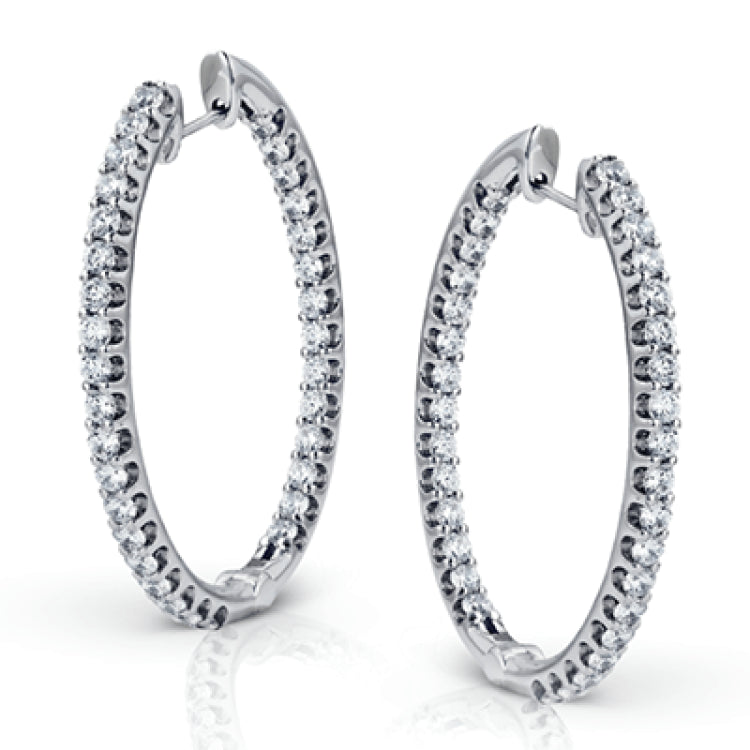 These classic white gold earrings sparkle with an impressive 1.96 ctw of white diamonds