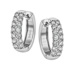 The clean design of these white gold earrings is elevated by 1.05 ctw of sparkling round white diamonds