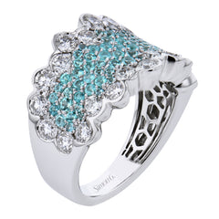 This wonderful fashion ring showcases .62 ctw of bright blue-green paraiba tourmaline in the center, surrounded by 1.91 ctw of white diamonds.