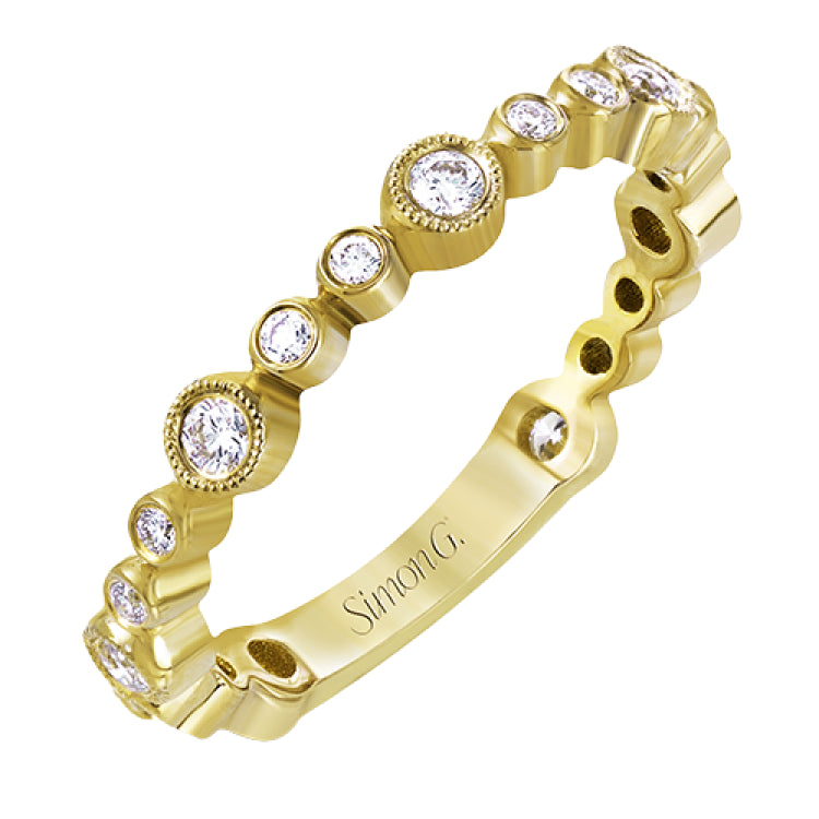 This lovely 18k yellow gold band showcases varied sizes of round white diamonds that total .30 ctw. Perfect for stacking.