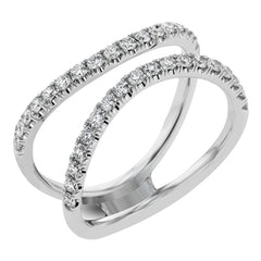This distinctive bridal set design features a double-layer wedding band that fits around the engagement ring. The set contains .77 ctw of white diamonds.