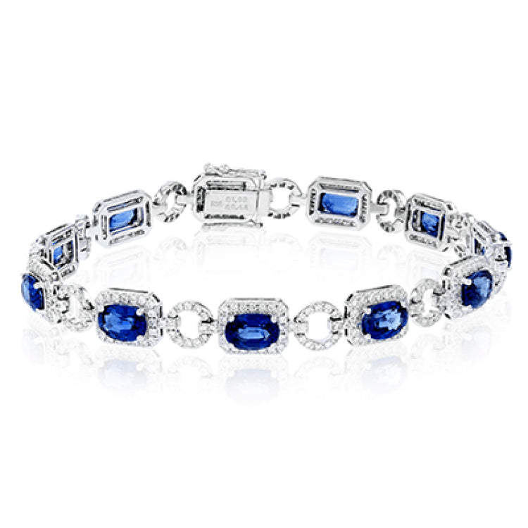 This 18k white gold bracelet is an instant heirloom with 9.06 ctw of blue sapphires and 2.21 ctw of round brilliant white diamonds.