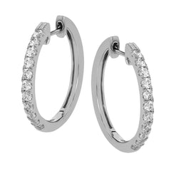 These 18k white gold medium-sized hoop earrings feature a setting style which shows off .61 ctw of  shining white diamonds.