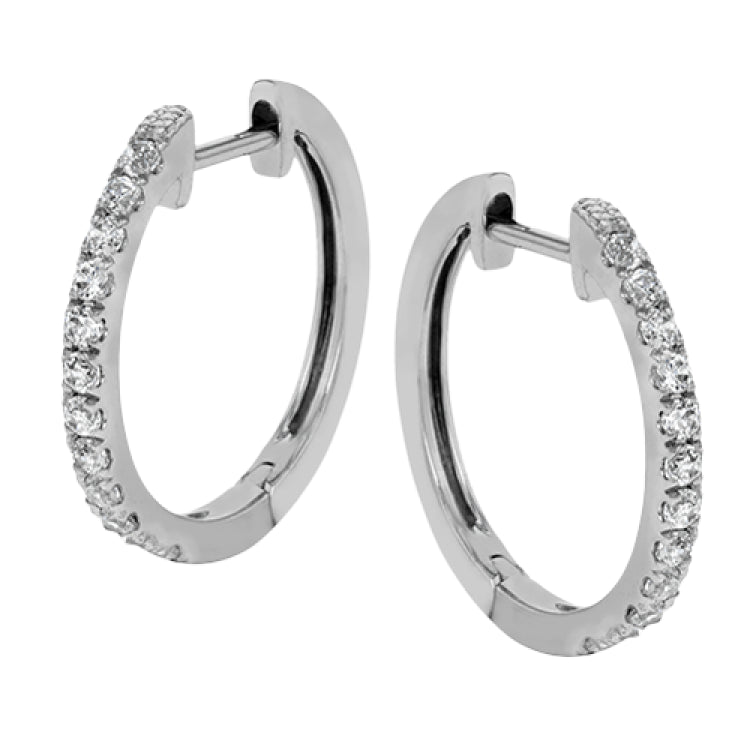 These classic hoop earrings are crafted from 18k white gold and set with .25 ctw of shining white diamonds.