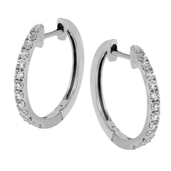 These classic hoop earrings are crafted from 18k white gold and set with .25 ctw of shining white diamonds.