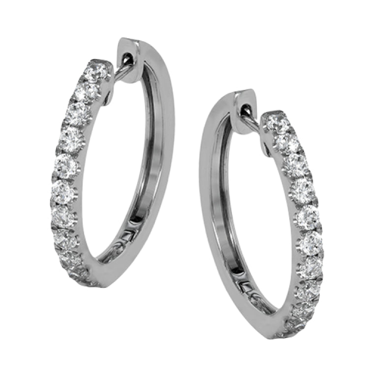 These timeless hoop earrings are set with a stunning 1.01 ctw of round white diamond and crafted from 18k white gold.