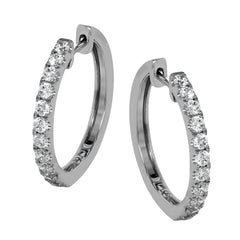 These timeless hoop earrings are set with a stunning 1.01 ctw of round white diamond and crafted from 18k white gold.