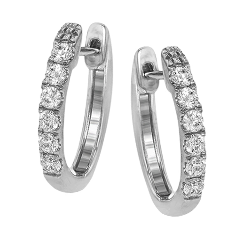 These timeless 18k white gold hoop earrings are set with .55 ctw of dazzling white diamonds.