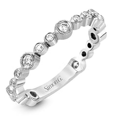 This wonderful stacking band can be worn with others or on its own. It has .30 ctw of multi-sized round white diamonds.