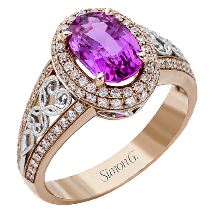 18KWR right hand ring with an intricate design along the shank has a diam halo .55 ctw, and an oval KNZT 5.89 ctw.