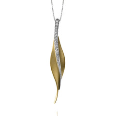 Featuring a contemporary leaf-like design, this striking yellow gold pendant contains a brilliant pilaster of .13 ctw shimmering round cut white diamonds.